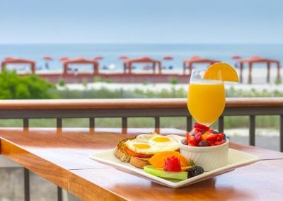 Harry's tomato egg toast with fresh fruit and OJ