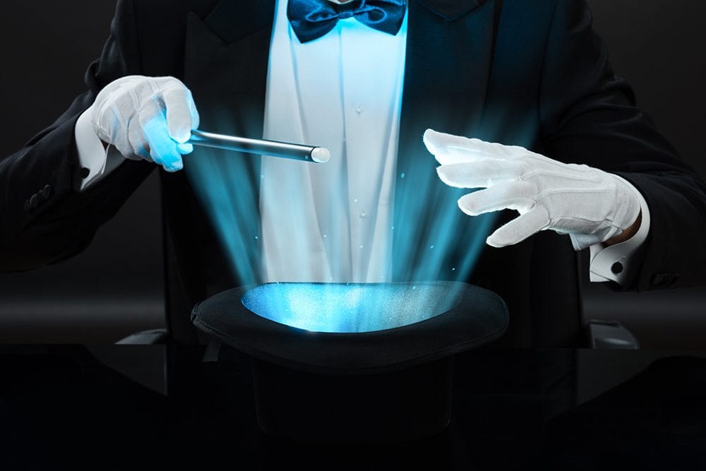 Magician holding wand. Decorative image.