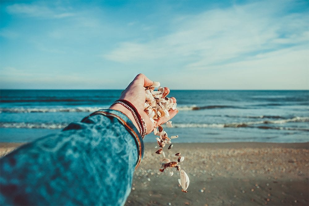 Woman with seashells Cape May NJ.