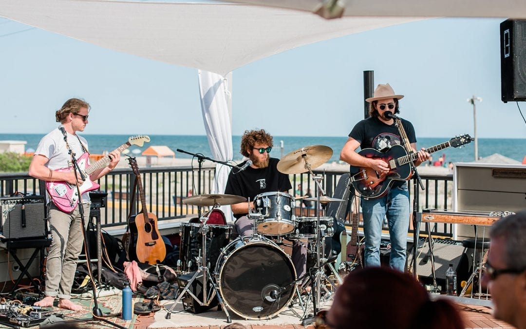 Band playing live music on Harry's rooftop bar.